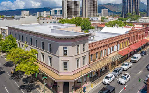 an aerial view of a building on a city street