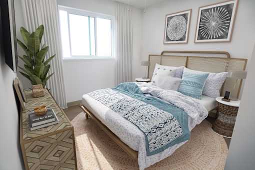 A bedroom with a bed, a nightstand, and a plant.