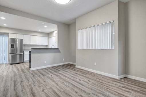 A kitchen with a refrigerator and a countertop is visible.