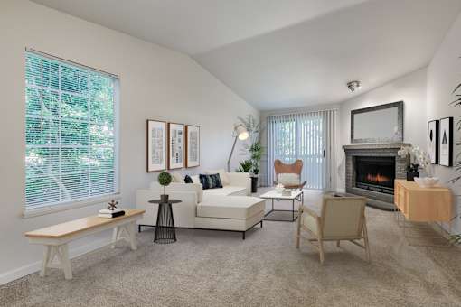 A living room with a fireplace, a couch, a chair, a coffee table, and a television.
