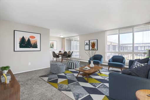 a living room with gray walls and a checkered rug