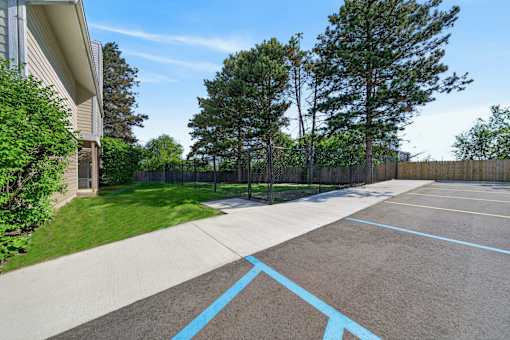 A parking lot with a blue line painted on the ground.