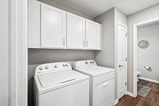 A laundry room with a washer and dryer.