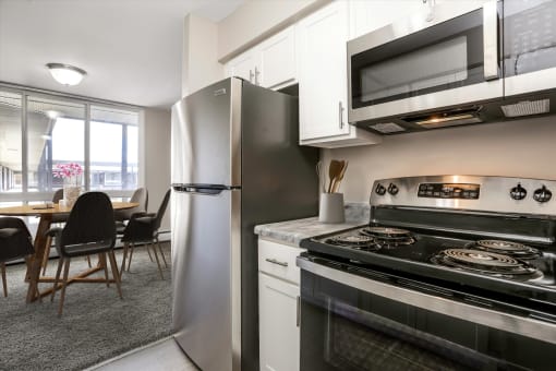 a kitchen and dining area in a 555 waverly unit