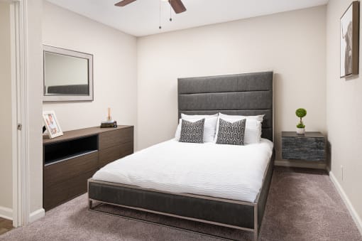 Bedroom with Grey Bed at Arbor Park Apartments, Jackson, MS, 39209