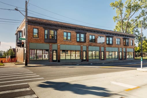 an old brick building on the corner of a street