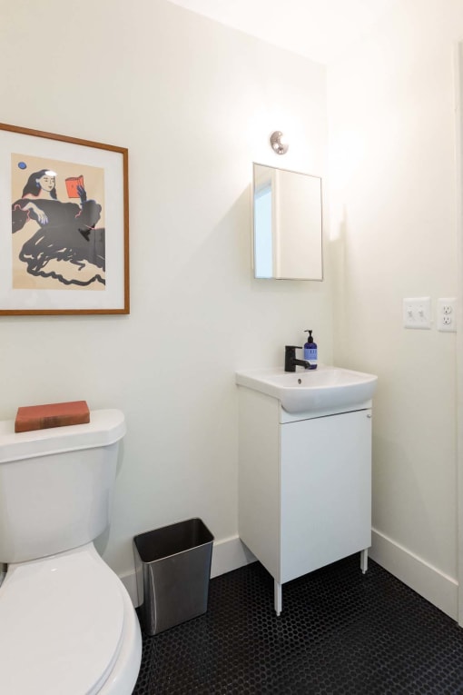 a bathroom with a toilet and a sink