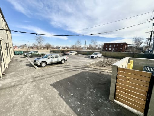 an empty parking lot with cars parked in it