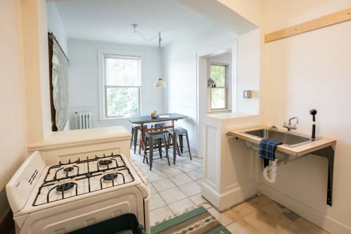 a kitchen with a stove and a sink