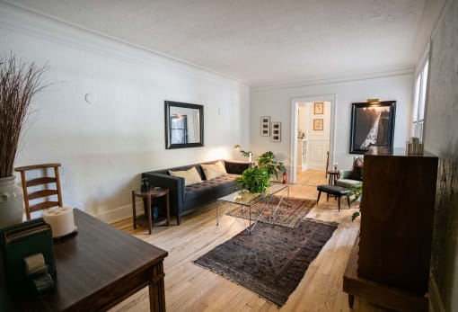 a living room with a couch and a table