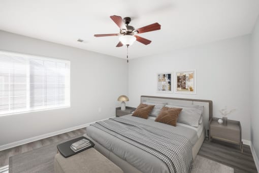 Bedroom with cozy bed at Valley View Estates, Council Bluffs