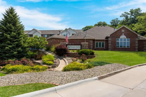 a house with a flag in front of it at Valley View Estates, Council Bluffs, 51503