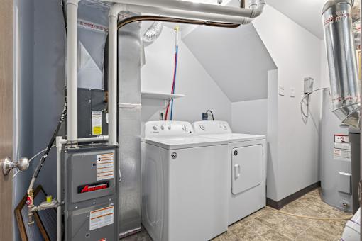 A washing machine and dryer in a small laundry room.