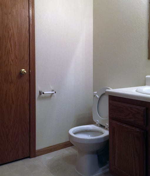 an empty bathroom with a toilet sink and bathtub