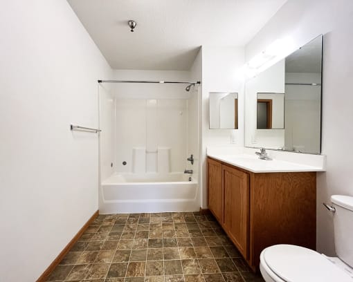 a bathroom with a toilet sink and a shower