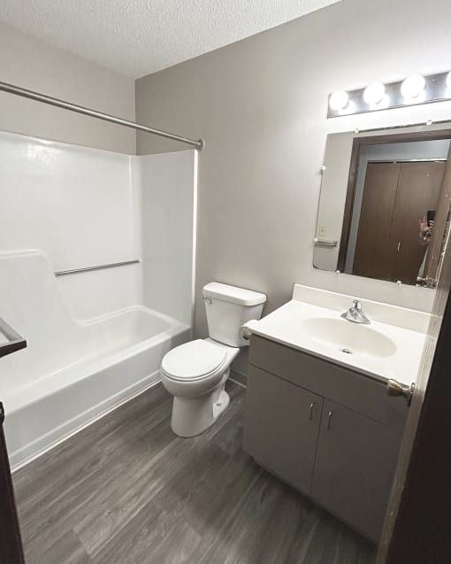 an empty bathroom with a toilet sink and tub