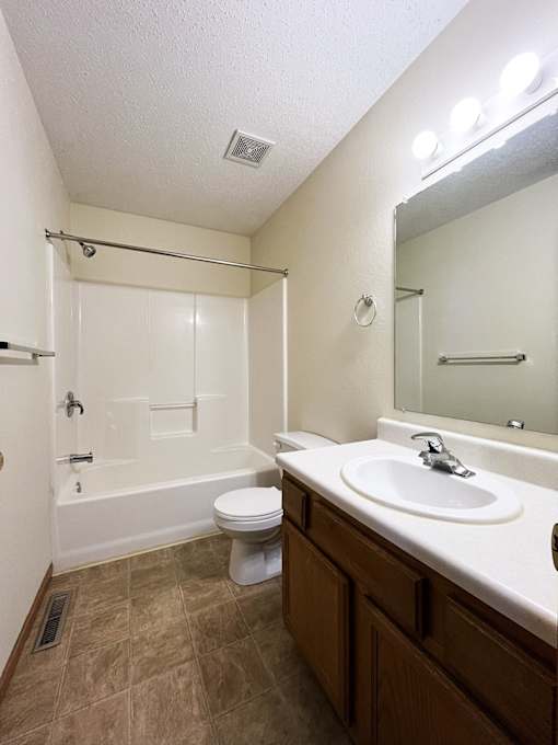 the preserve at ballantyne commons apartment bathroom with sink toilet and shower