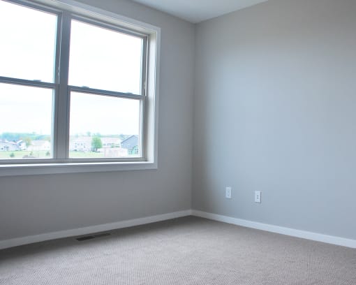 an empty room with a large window