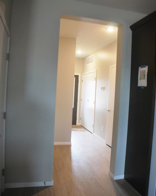 a view of the hallway from the living room