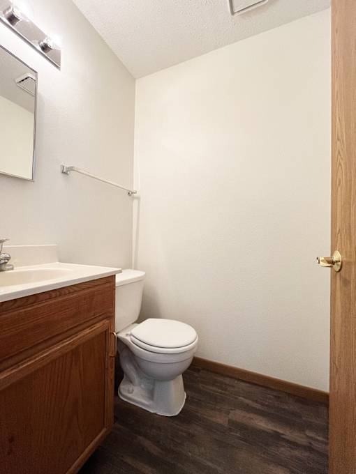 an empty bathroom with a toilet and a sink