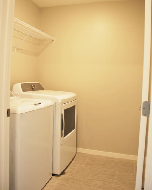 a laundry room with a washer and dryer