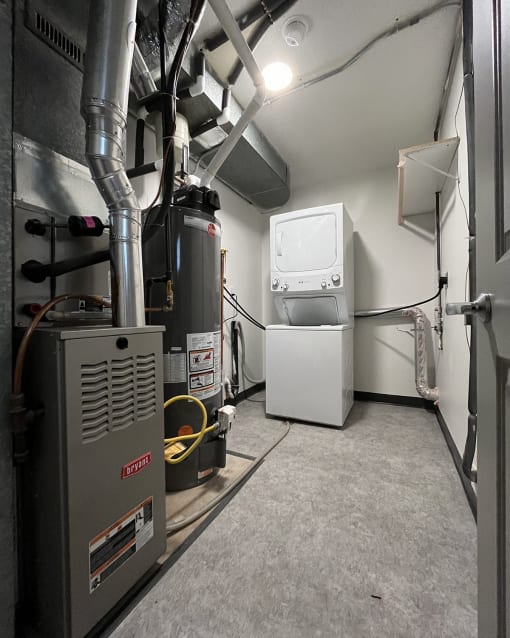 a room with a heater and a washing machine in it