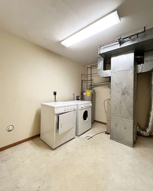 A laundry room with a washer and dryer.