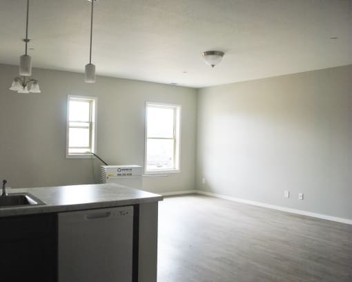 an empty kitchen and living room