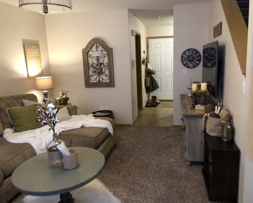 a living room with a couch and a table