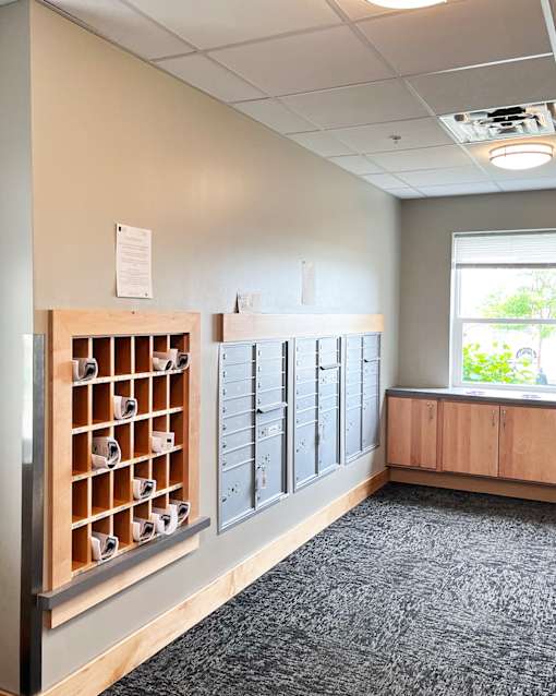 A room with a filing cabinet and a window.