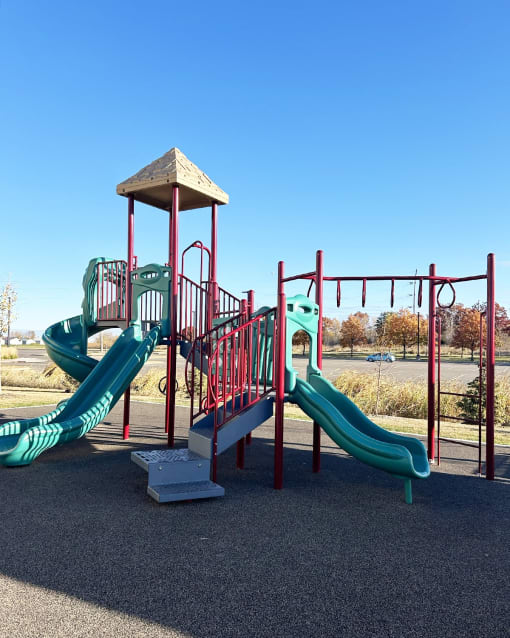 a playground with slides at a park