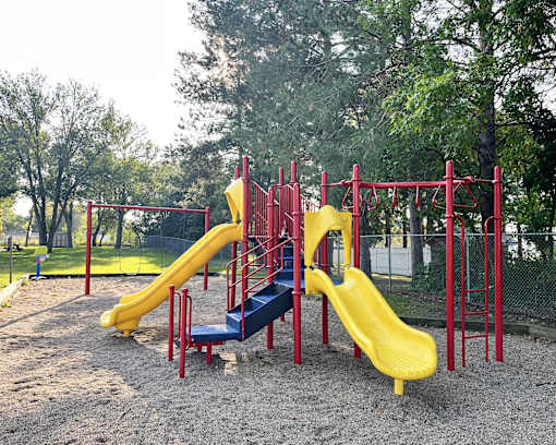 a playground with slides at a park