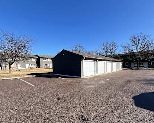 A large garage door is on the right side of a building.