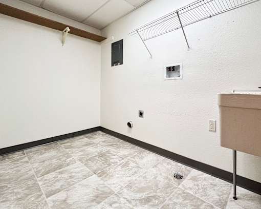 A room with a tile floor and a small window.