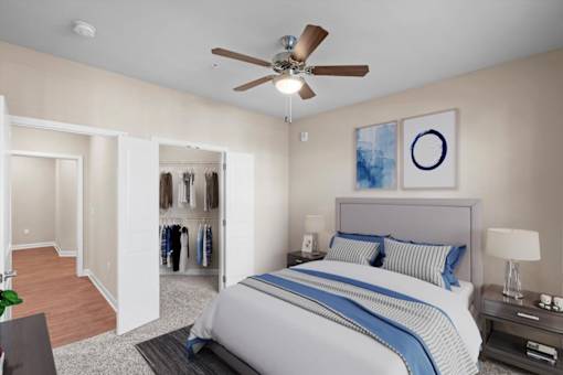 a bedroom with a large bed and a ceiling fan at The Dorset, Kansas City, Missouri