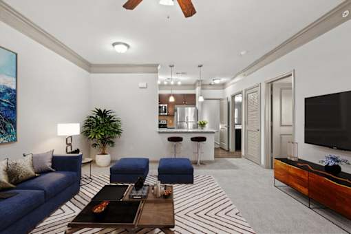 a living room with couches and a coffee table at Stonepost Crossing Apartments, Overland Park