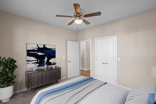 a bedroom with a bed and a ceiling fan at The Dorset, Kansas City, 64112
