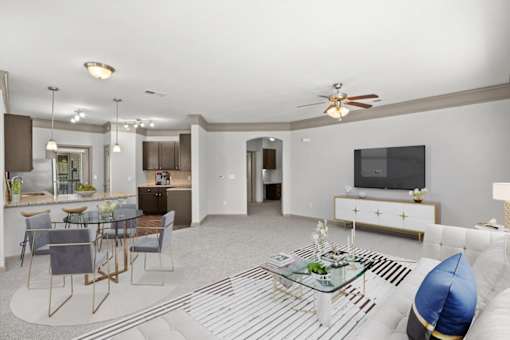 a living room with a couch and a table at Stonepost Crossing Apartments, Overland Park, Kansas