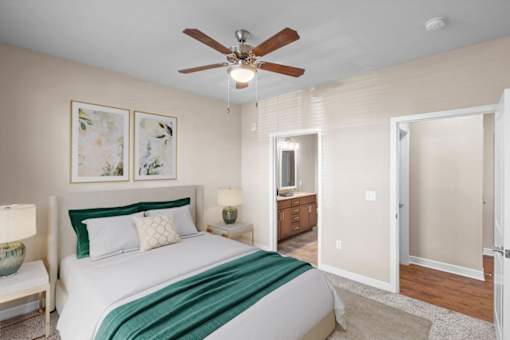 a bedroom with a bed and a ceiling fan at The Dorset, Kansas City, MO