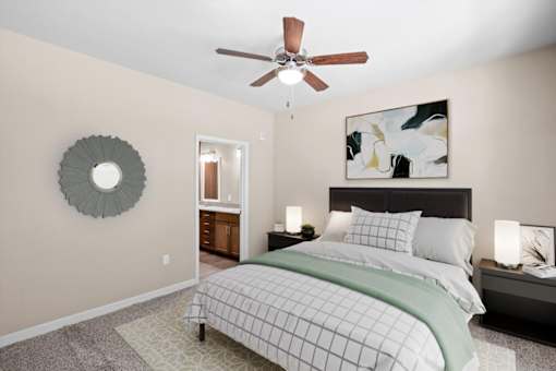 a bedroom with a bed and a ceiling fan at The Dorset, Kansas City, Missouri