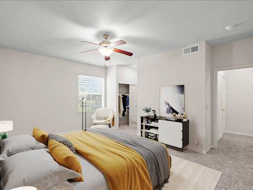 A large bedroom with a ceiling fan, a window and a bedroom closet. at Crescent Apartment Homes, Lenexa, 66219