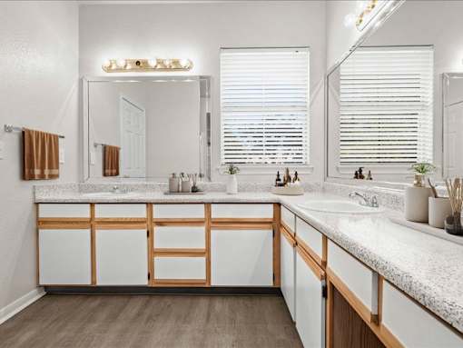 A large bathroom with a ton of counter space and under the sink storage. at Crescent Apartment Homes, Lenexa, 66219