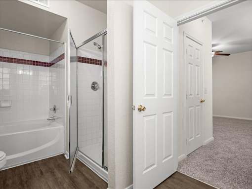 A bathroom with a shower and bath tub. at Crescent Apartment Homes, Kansas, 66219