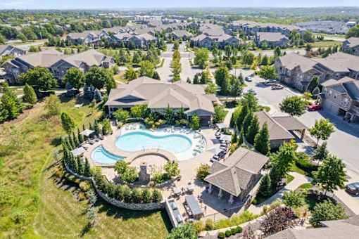 an aerial view of a house with a pool in the yard at Stonepost Crossing Apartments, Overland Park, KS, 66213