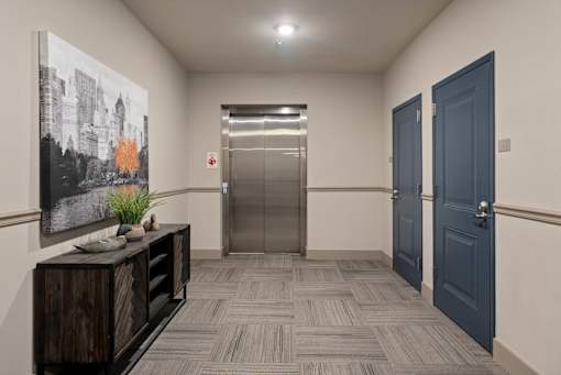 Interior hallway at The Dorset with elevator access and nearby apartment doors