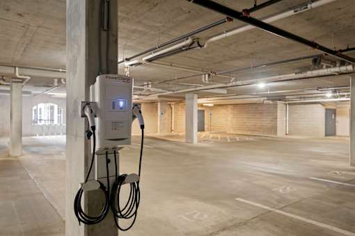 Electric vehicle charging station in The Dorset parking garage for resident use