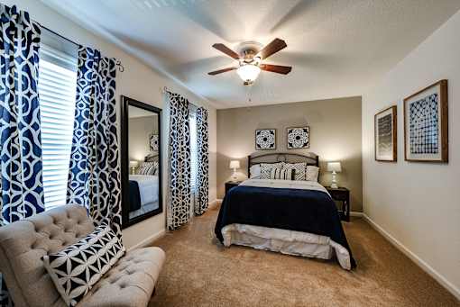 Spacious bedroom with double windows for natural lighting at Fords Pointe