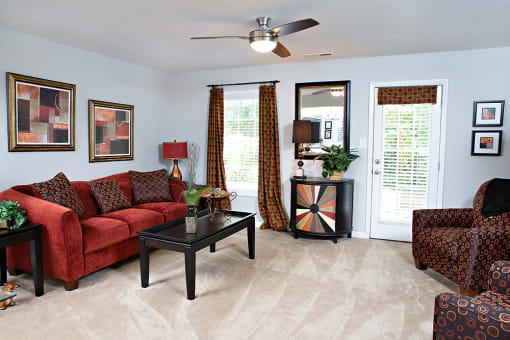 Spacious living room with door to private patio