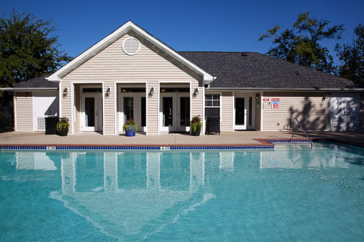 Resort style swimming pool with lounge chairs