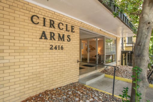 a brick building with the words arms on the side